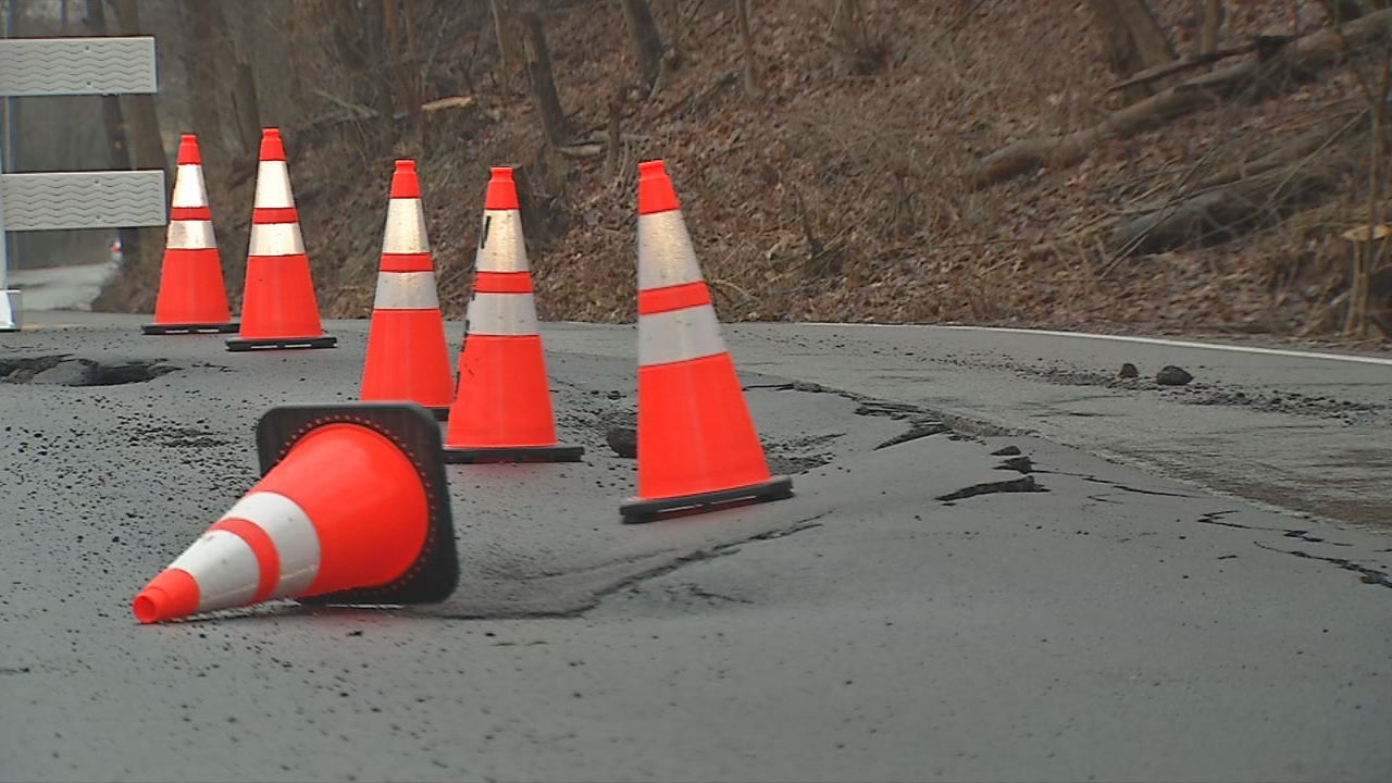 Portion of Old Vincennes Road cracking and sinking into ground